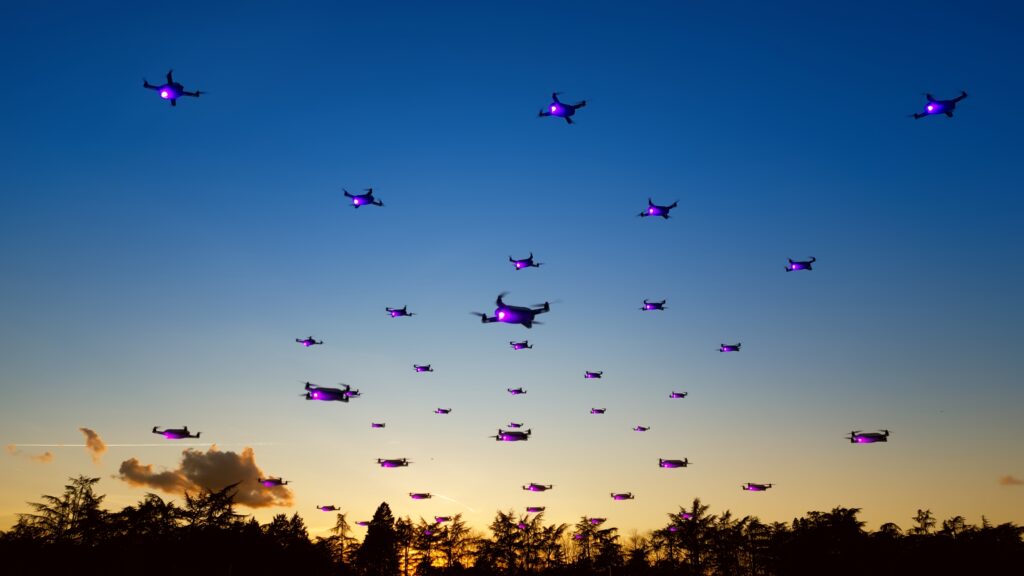 un enjambre de drones luminosos en el cielo azul